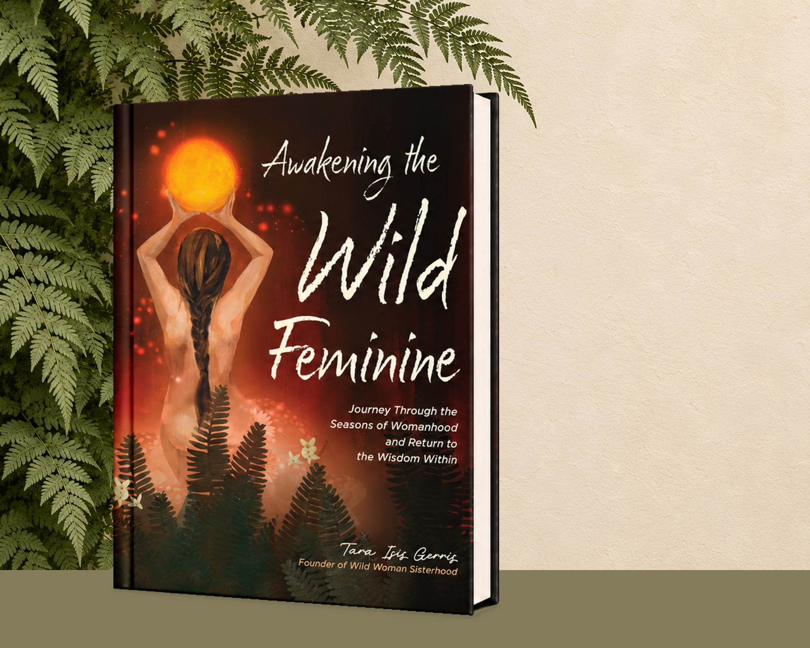 Hardcover of Awakening the Wild Feminine by Tara Isis Gerris standing in front of fern fronds